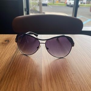 Black Michael Kors sunglasses.